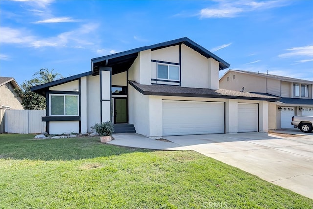 view of front of home featuring a front yard and a garage