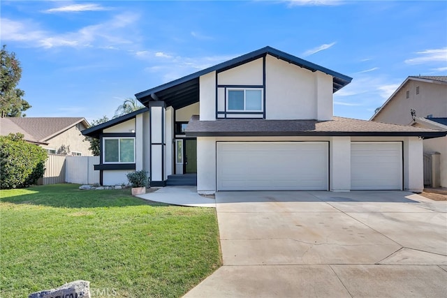 view of front of property with a front yard and a garage