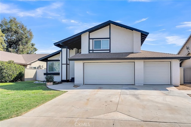 view of front of home featuring a front lawn and a garage