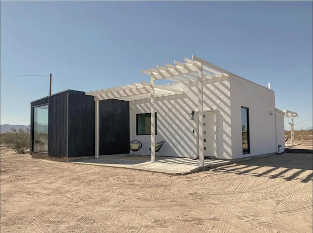 view of outdoor structure featuring a pergola