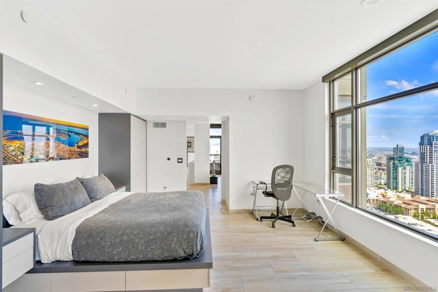 bedroom with light hardwood / wood-style floors