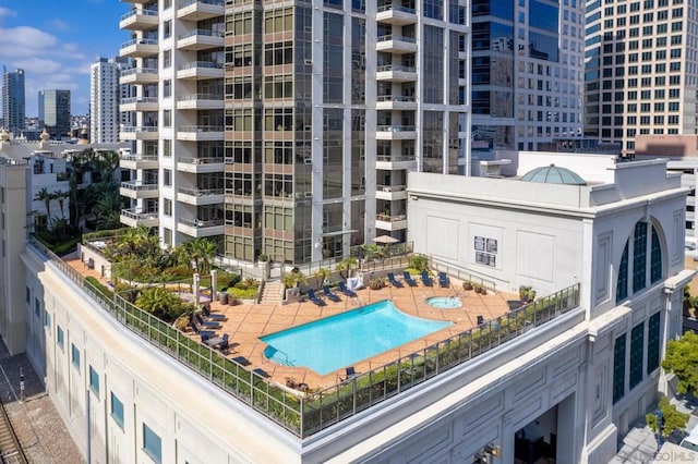 view of building exterior with a community pool