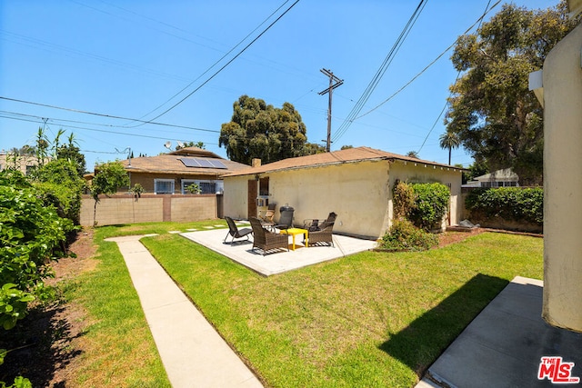 view of yard with an outdoor living space and a patio