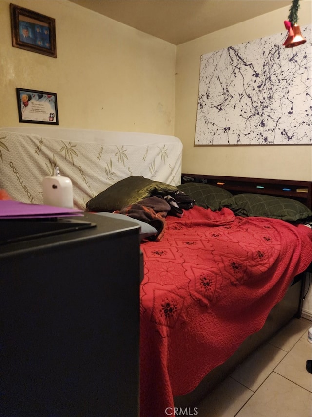 bedroom featuring light tile patterned floors