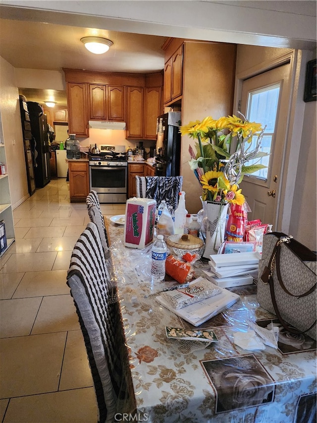 dining area featuring light tile patterned floors