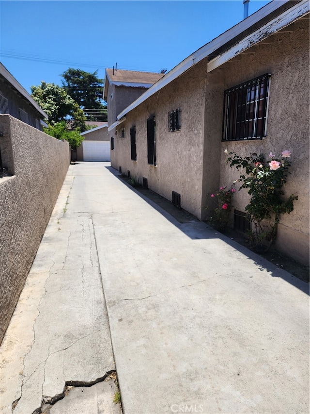 view of side of property with a patio