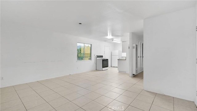 unfurnished living room with light tile patterned floors