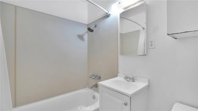 full bathroom featuring shower / bath combination, vanity, and toilet