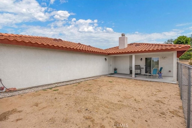 rear view of house with a patio