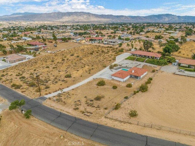 birds eye view of property featuring a mountain view