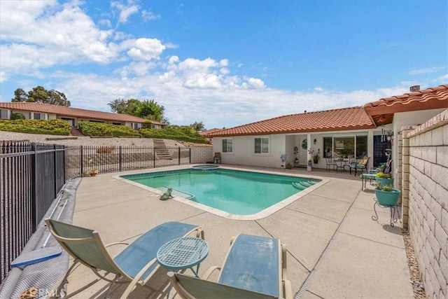 view of pool featuring a patio