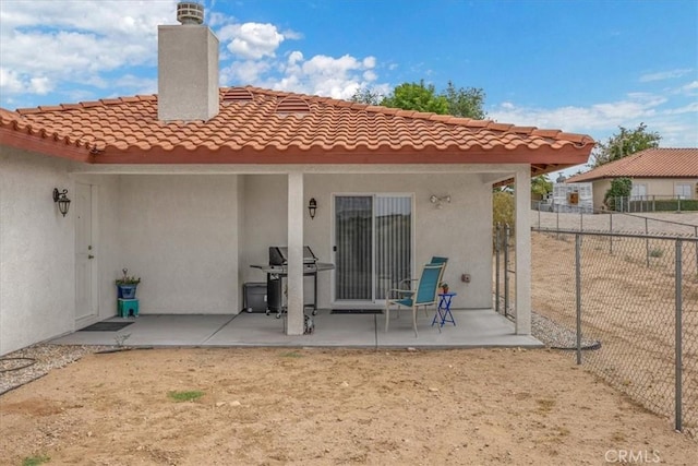 back of property featuring a patio area