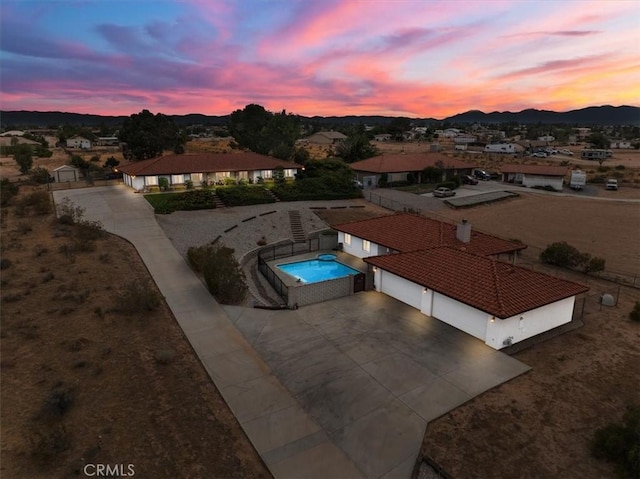 aerial view at dusk with a mountain view