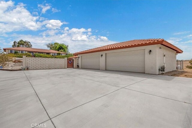 view of side of home with a garage