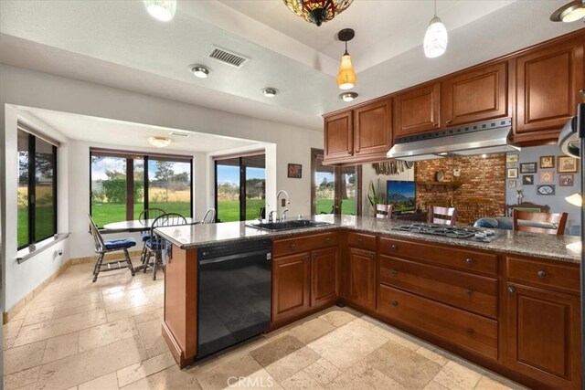 kitchen featuring dishwasher, hanging light fixtures, sink, kitchen peninsula, and stainless steel gas cooktop