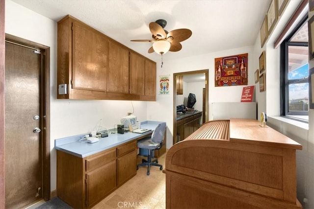 office area featuring built in desk and ceiling fan