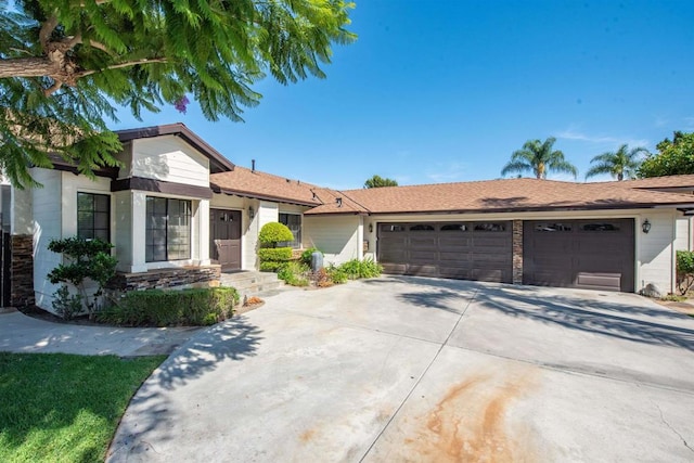 single story home featuring a garage