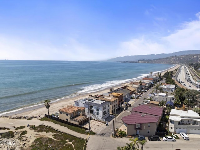 bird's eye view with a view of the beach and a water view