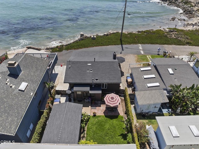 bird's eye view with a water view and a beach view