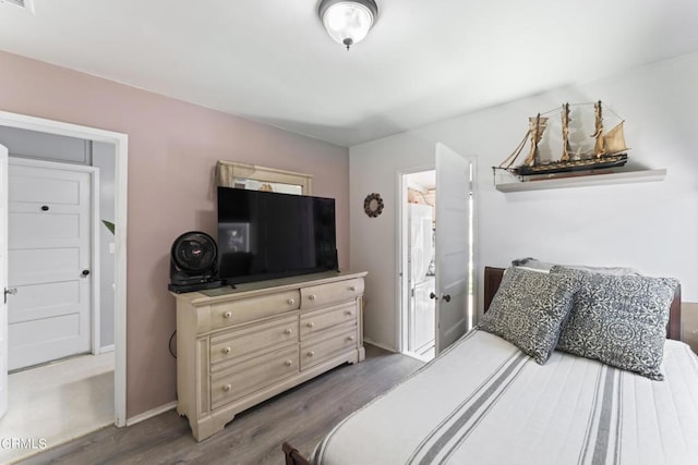 bedroom featuring dark wood-type flooring