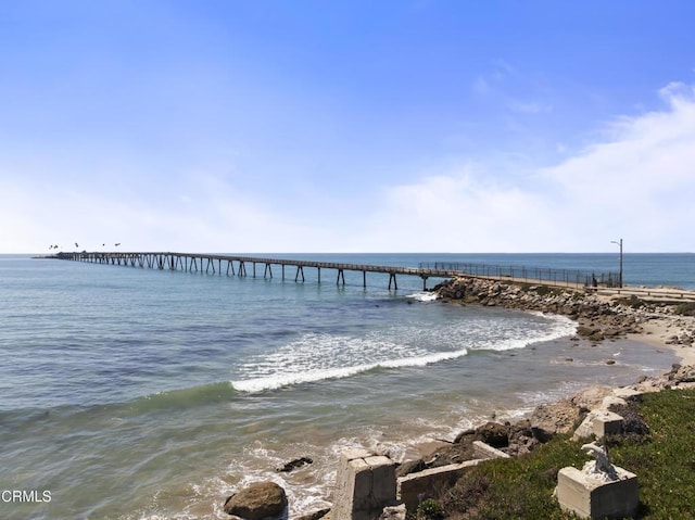 dock area featuring a view of the beach and a water view