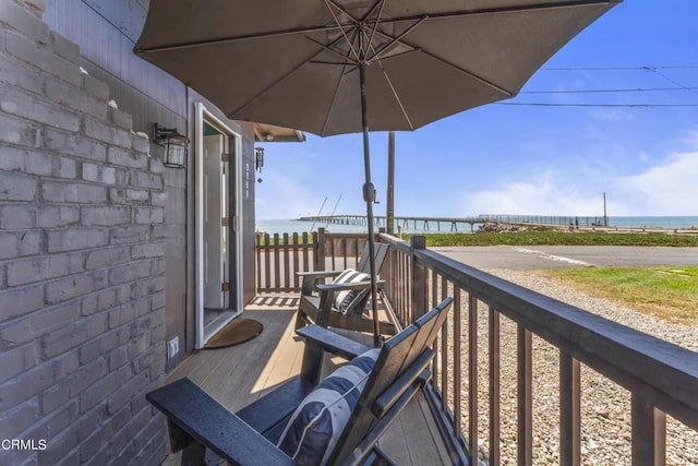 balcony featuring a water view