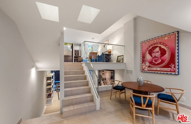 interior space with carpet and a skylight