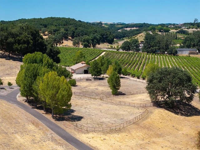 exterior space with an enclosed area, fence, and a rural view