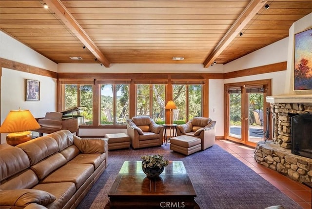 tiled living area with wooden ceiling, visible vents, vaulted ceiling with beams, and a stone fireplace