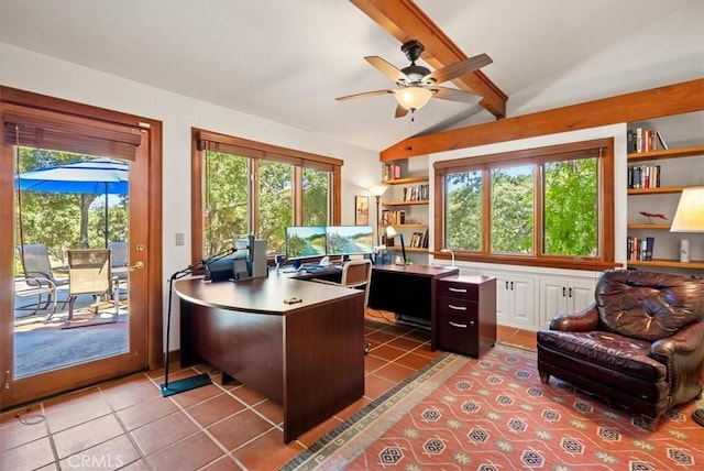 office space featuring lofted ceiling with beams, ceiling fan, built in shelves, and tile patterned flooring