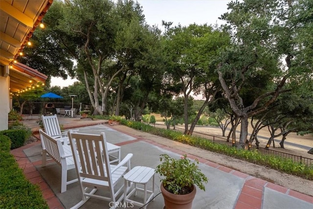 view of patio / terrace featuring outdoor dining space and fence