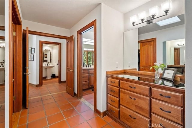 bathroom with a sink and tile patterned flooring