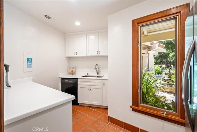 kitchen featuring a sink, white cabinets, black dishwasher, light countertops, and stainless steel fridge with ice dispenser