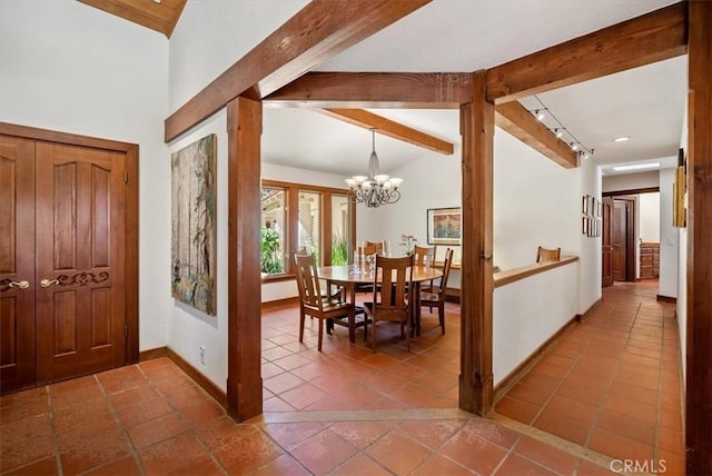 tiled dining room featuring vaulted ceiling with beams, baseboards, and a chandelier