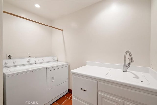 clothes washing area with cabinet space, washing machine and clothes dryer, tile patterned flooring, a sink, and recessed lighting