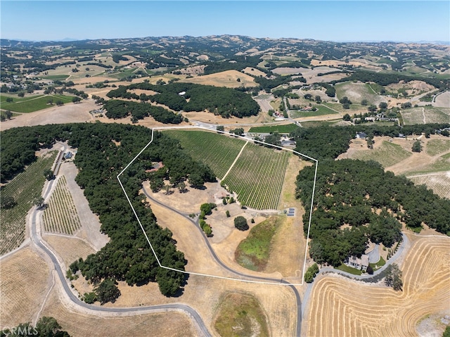 birds eye view of property with a rural view