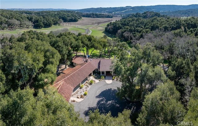 aerial view featuring a wooded view