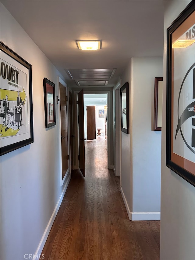 hallway with dark hardwood / wood-style flooring