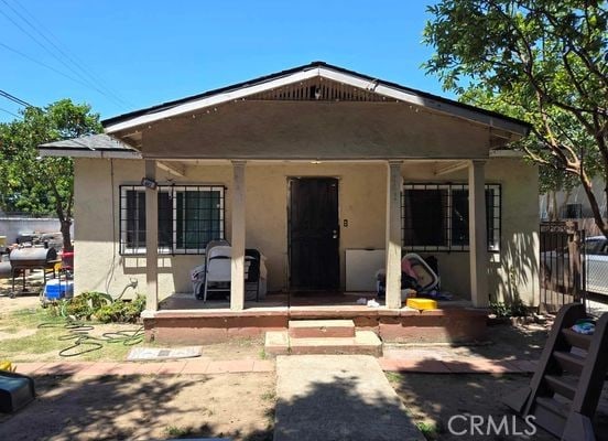 back of house with a patio