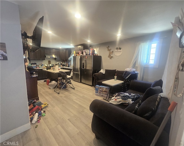 living room with light hardwood / wood-style flooring