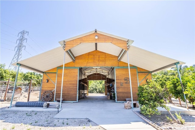 exterior space with a carport and an exterior structure