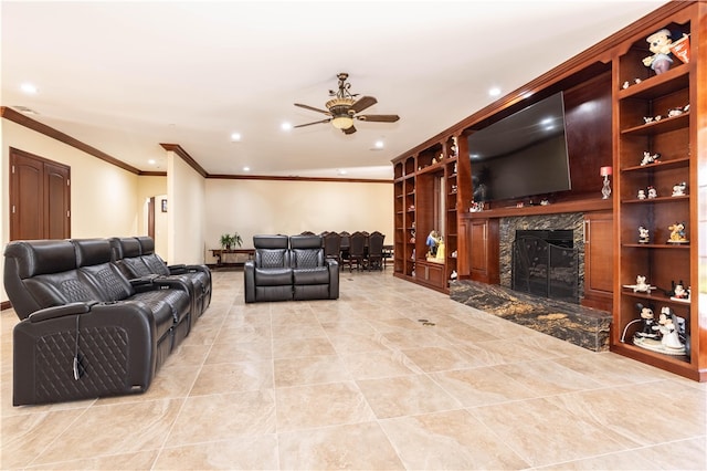 living area featuring recessed lighting, a ceiling fan, crown molding, and a high end fireplace