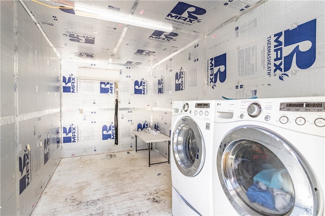 laundry area with laundry area and washing machine and clothes dryer