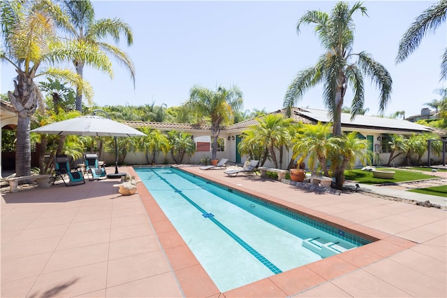 view of swimming pool with a patio area and a fenced in pool