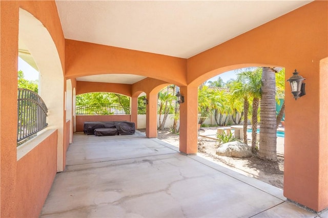 view of patio / terrace featuring fence