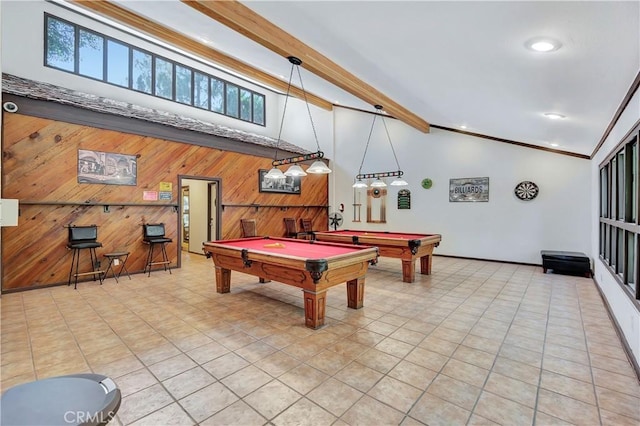 playroom featuring lofted ceiling with beams, ornamental molding, wood walls, light tile patterned flooring, and pool table