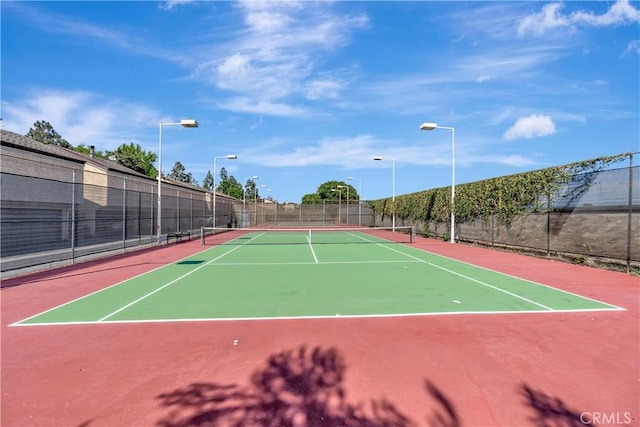 view of sport court featuring basketball hoop