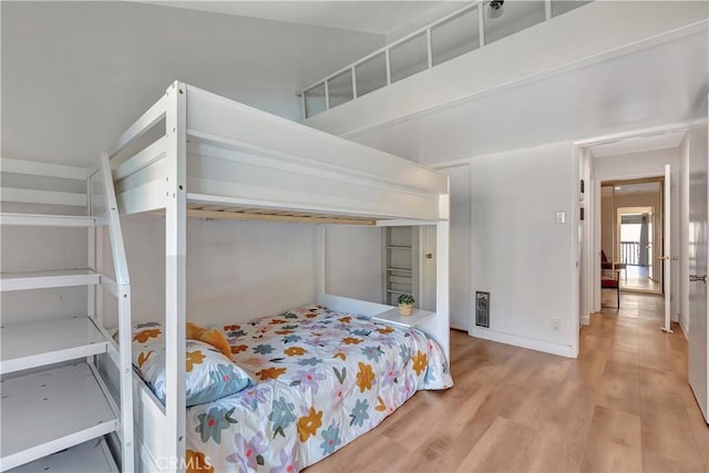 bedroom featuring wood-type flooring