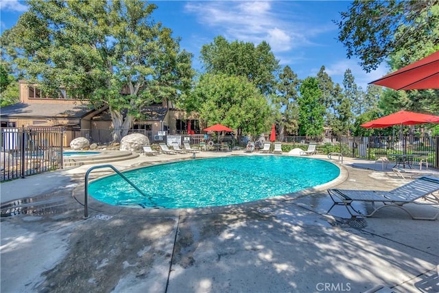 view of swimming pool featuring a patio