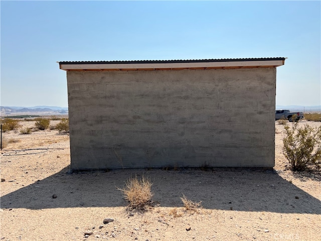 view of side of home featuring a mountain view